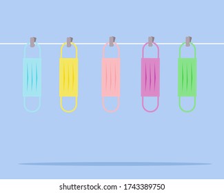 Always wear mask (New Normal after covid-19 crisis) concept: Many colorful of cloth or fabric face masks hang after used. Cartoon vector style for your design. 