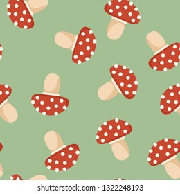 Amanita mushroom colorful doodle on green background seamless pattern