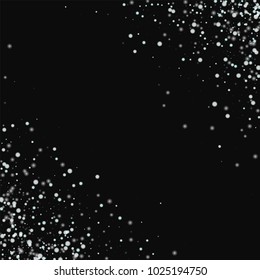 Amazing falling snow. Scatter cornered border on black background. Fascinating vector illustration.