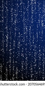 Amazing falling stars Christmas background. Subtle flying snow flakes and stars on dark blue background. Alive winter silver snowflake overlay template. Artistic vertical illustration.