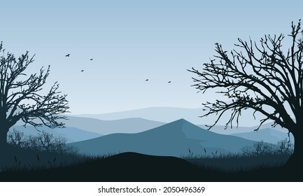 Amazing mountain view in the morning from the countryside with the silhouettes of dry trees around it. Vector illustration of a city