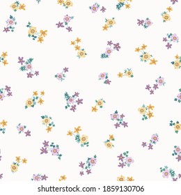 Amazing seamless floral pattern with bright colorful small flowers. Folk style millefleurs. Elegant template for fashion prints. 