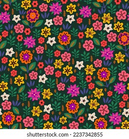 Amazing seamless floral pattern with bright multicolored flowers and leaves on a green background. An elegant template for fashionable prints. Modern floral background. Folk style.