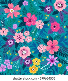 Amazing seamless floral pattern with bright colorful flowers  and leaves on a blue background. The elegant the template for fashion prints. Modern floral background. Folk style.