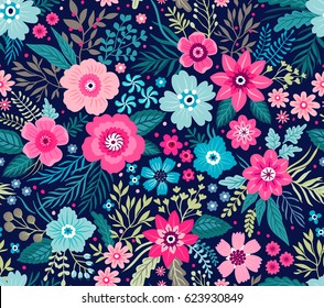 Amazing seamless floral pattern with bright colorful flowers and leaves on a dark blue background. The elegant the template for fashion prints. Modern floral background. Folk style