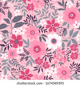 Amazing seamless floral pattern with light pink flowers and leaves on a pastel pink background. The elegant the template for fashion prints. Modern floral background.