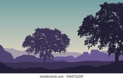 Amazing view of the mountains in the morning with the silhouettes of the shady trees around it. Vector illustration of a city