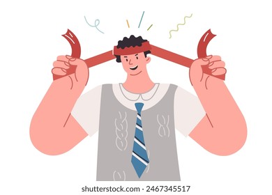 Ambitious business man is ready to work and solve complex problems, tying red bandage on forehead. Brave guy manager with smile is in hurry to start working on increasing business profits