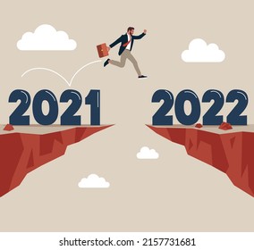 Ambitious businessman jump over year gap from 2021 to 2022. Year 2022 hope, new year resolution or success opportunity, change to new business bright future, overcome business difficulty concept.