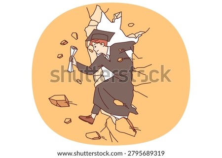 Ambitious guy, university graduate, breaks through obstacle thanks to self-confidence and presence of educational diploma. Man graduate in academic robe demonstrates power and desire for success