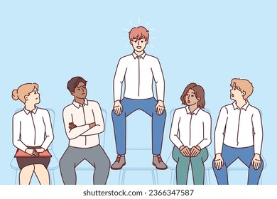 Ambitious man stands out among candidates for vacant position, sitting above all and causing envy of competitors. Ambitious guy wants to get good job offer and demonstrates superiority over rivals