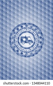 ambulance icon inside blue badge with geometric pattern.