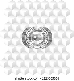ambulance icon inside grey emblem with cube white background