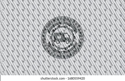 icono de ambulancia dentro de una placa o emblema plateado. Patrón de escalas. Ilustración vectorial. Detallado.