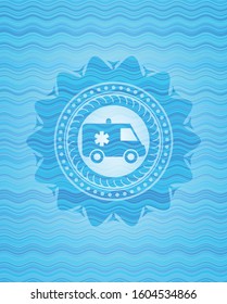 ambulance icon inside sky blue water wave emblem background.