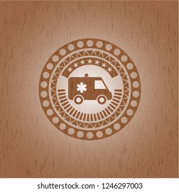 ambulance icon inside wooden emblem