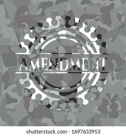 Amendment written on a grey camouflage texture