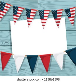 america bunting decoration on blue wood background with card for your text