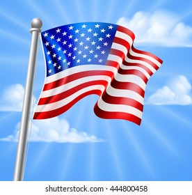 The American flag on a flag pole flying against a blue sky