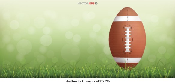 American football ball with background of green grass field and light blurred bokeh. Vector illustration.