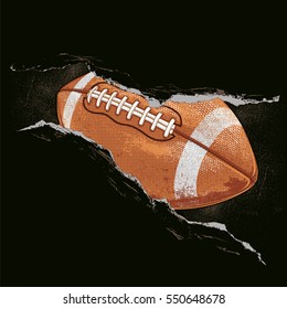 American football ball behind a rip