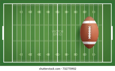 American football ball with green football field background. Vector illustration.