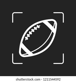 American Football logo. Simple rugby ball icon. White object in camera autofocus on dark background