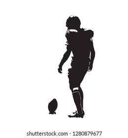 American football player preparing for kick, isolated vector silhouette. Team sport