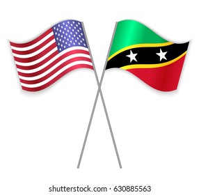 American and Kittitian crossed flags. United States of America combined with Saint Kitts and Nevis isolated on white. Language learning, international business or travel concept.