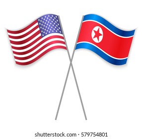 American and North Korean crossed flags. United States of America combined with North Korea isolated on white. Language learning, international business or travel concept.