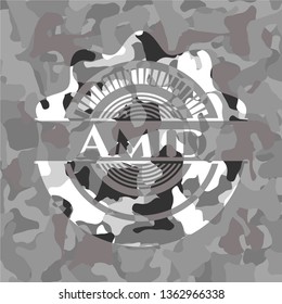 Amid grey camouflaged emblem