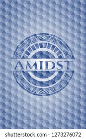 Amidst blue emblem with geometric pattern.