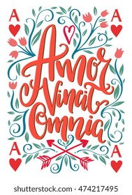 Amor vincit omnia lettering design - Love conquers all. Unique creative hand drawn lettering design. Typographic poster or tattoo illustration. Popular Latin phrase.