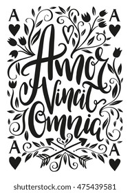 Amor vincit omnia lettering design - Love conquers all. Unique creative hand drawn lettering design. Typographic poster or tattoo illustration. Popular Latin phrase.