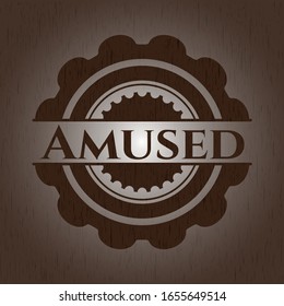 Amused badge with wood background