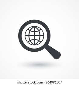 Analyzing world. Magnifier glass with globe