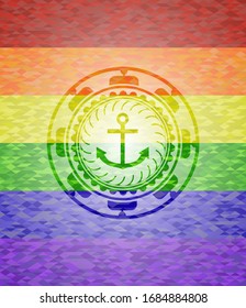 icono de ancla dentro del emblema sobre fondo de mosaico con los colores de la bandera LGBT