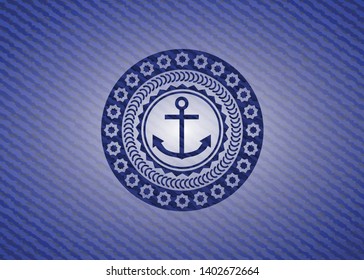anchor icon inside jean or denim emblem or badge background