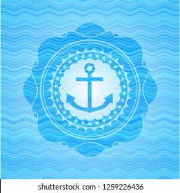 anchor icon inside sky blue water wave style badge.