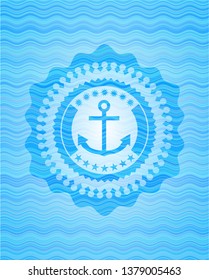 anchor icon inside sky blue water wave emblem.