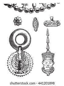 Ancient Assyrian jewels and earrings, found in Nineveh in Iraq,  preserved at the Louvre Museum. From Fine Arts Book, vintage engraving, 1880.
