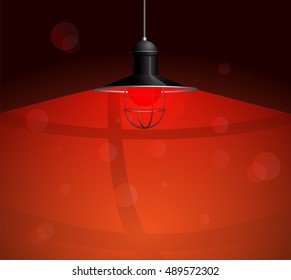 Ancient black lamp with red bulb hanging on the wire. Big and empty space illuminated on the dark red wall. Vector illustration of lighting.