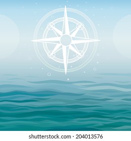 Ancient compass on a sea background