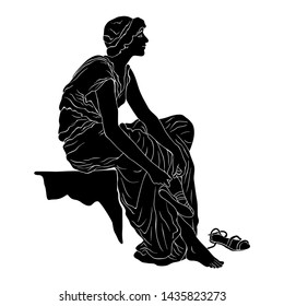 An ancient Greek young woman sits and takes off her sandals. Vector image isolated on white background.