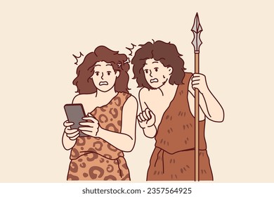Ancient people with mobile phone in hands marvel at technology from future during random time travel. Ancient man and woman in animal skins are looking at smartphone, feeling in awe of magical gadget.
