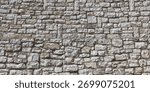 Ancient stone wall, large grey rock texture background.