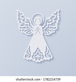 Angel with beautiful ornamental wings on a light background. Front view silhouette of angel in paper cut style with shadow. Isolated vector illustration for Christmas, New Year, Easter design