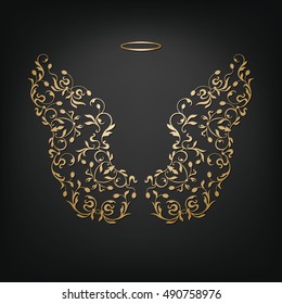 Angel design elements - golden wings and halo isolated on the black background. Abstract vector illustration of ornamental elegant angel wings.