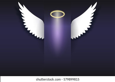 Angel wings with golden halo hovering in the dark. Wings and golden halo. Card with white angelic wings with place for your text