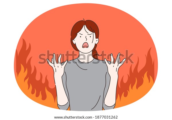 Anger, evil, furious woman concept. Young angry furious\
female cartoon character standing with fingers out and expressing\
rage and anger over burning fire at background vector illustration\
